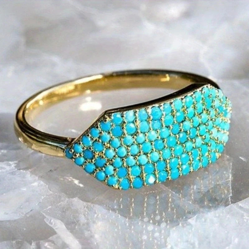 Blue topaz Butterfly cocktail ring from Corporación Turística featuring a detailed butterfly design and sparkling gemstone.