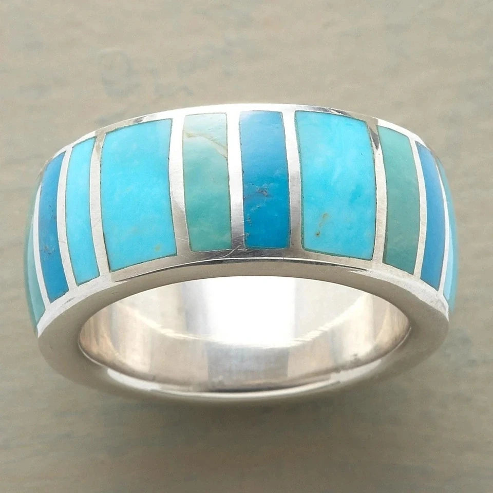 Lujoso anillo de cóctel Butterfly con topacio azul, joyería elegante en plata, diseñado por Corporación Turística.
