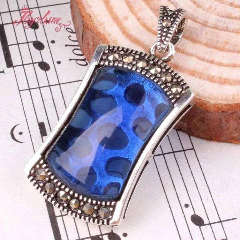 Rectangular Tibetan silver beads with blue CZ crystals, ideal for jewelry making or gifts.