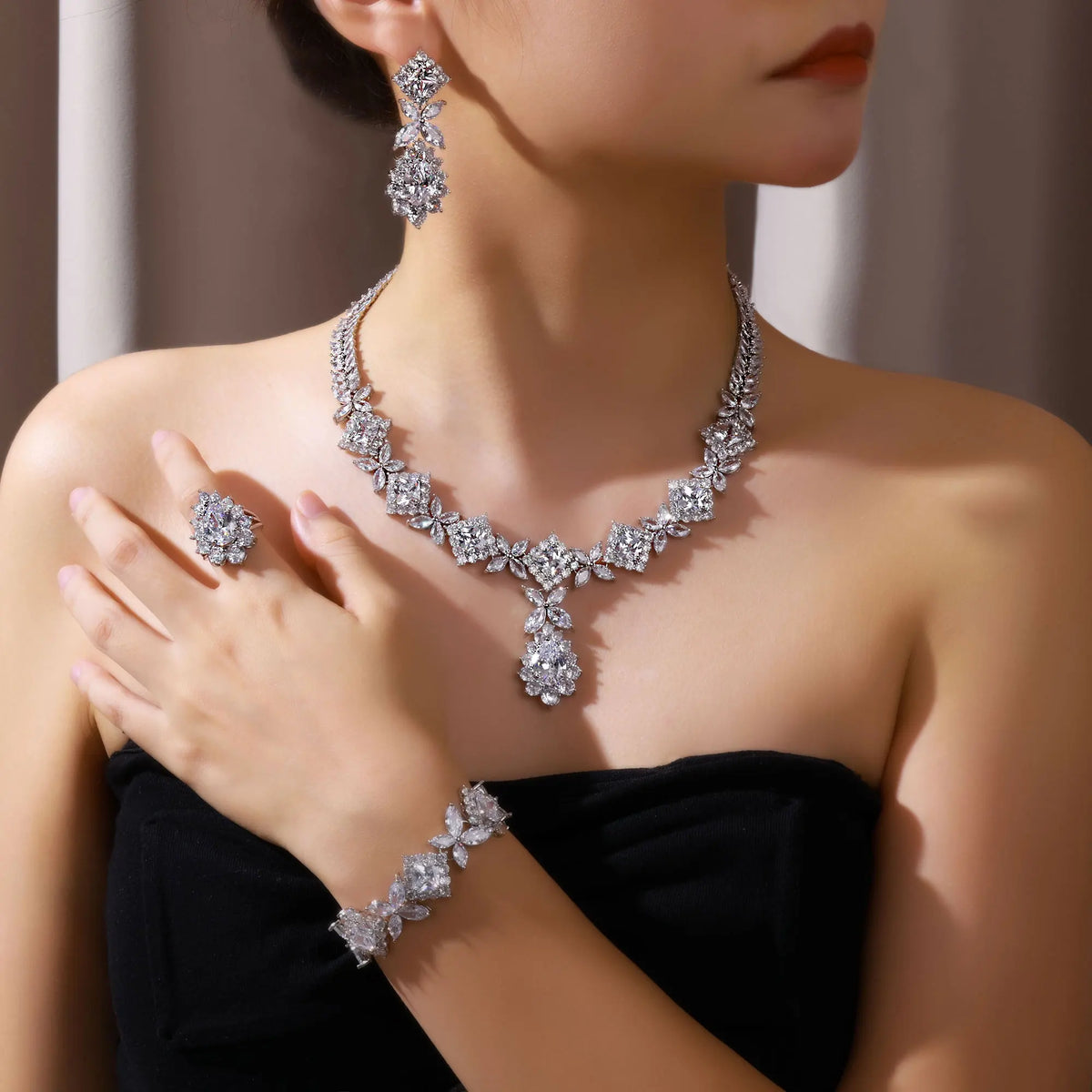 Elegant 2024 bridal jewelry set with zircon stones from Corporación Turística, featuring a blue and red adjustable necklace.