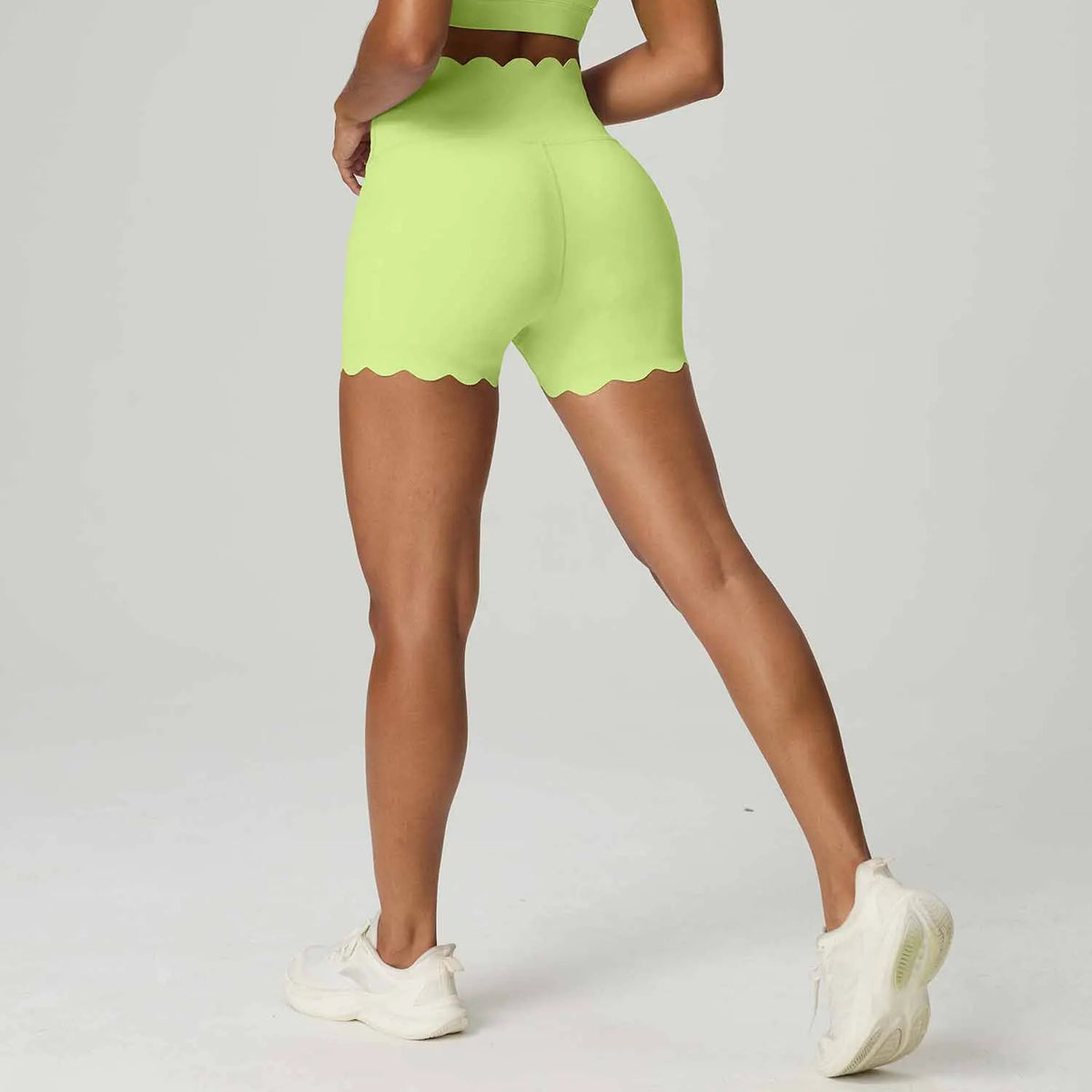 Blue high-waisted yoga shorts for women with abdominal control, from Corporación Turística, shown on a plain background.