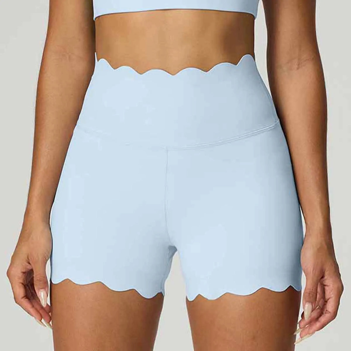 Blue high-waist yoga shorts for women by Corporación Turística, designed for abdominal control and comfortable movement.
