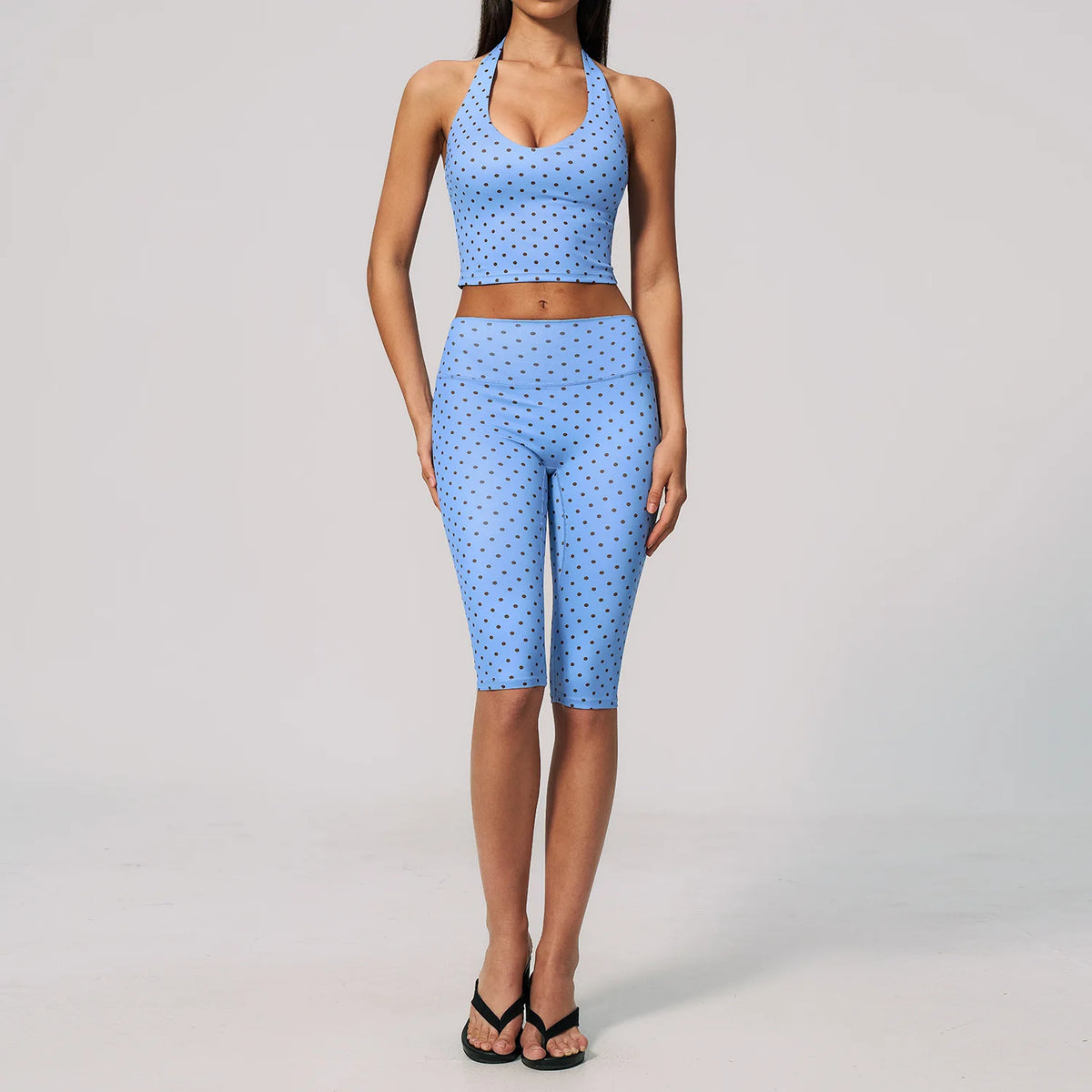 Blue and brown 2-piece women's sports set by Corporación Turística, includes a yoga top and leggings, perfect for active wear.