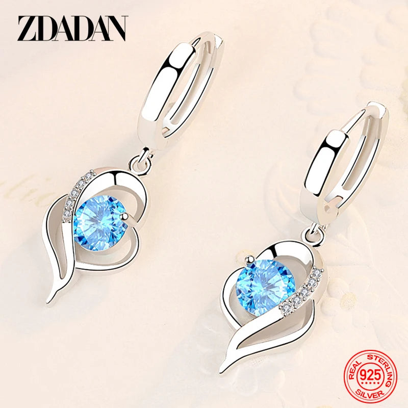 Blue zircon crystal earrings for women by Corporación Turística, featuring sparkling gemstone pendants.