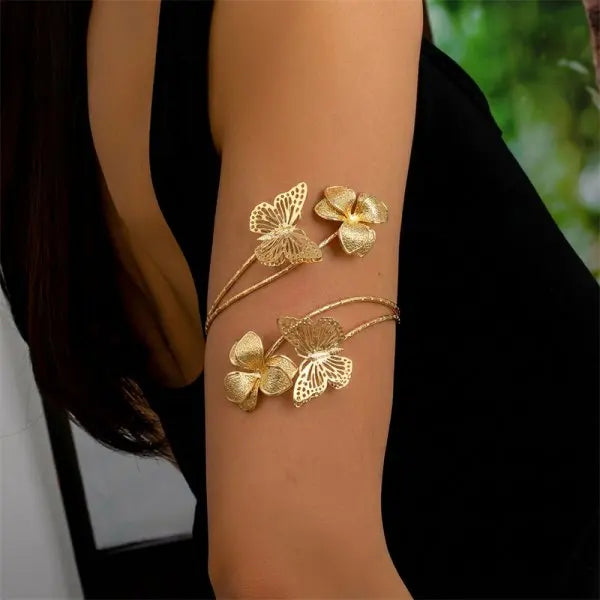 Open multicolored floral bracelet from Corporación Turística featuring hollow flower designs on a flexible band.