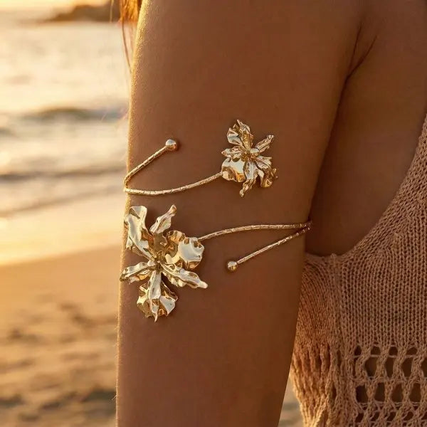 Open multicolored flower bracelet by Corporación Turística featuring hollow floral designs on a vibrant band.