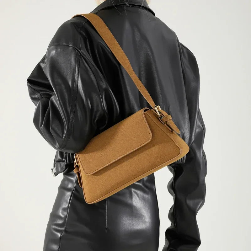 Luxury purple single-shoulder handbag for women by Corporación Turística, featuring a sleek design and elegant finish.