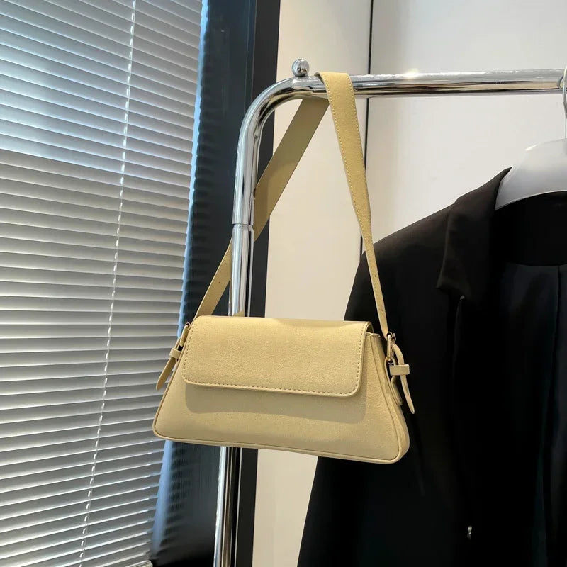Luxury purple single-shoulder women's handbag by Corporación Turística, showing the stylish design and size of the bag.