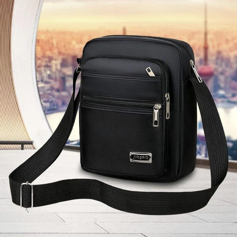 Brown waterproof crossbody bag for men with six zipper compartments, designed by Corporación Turística.