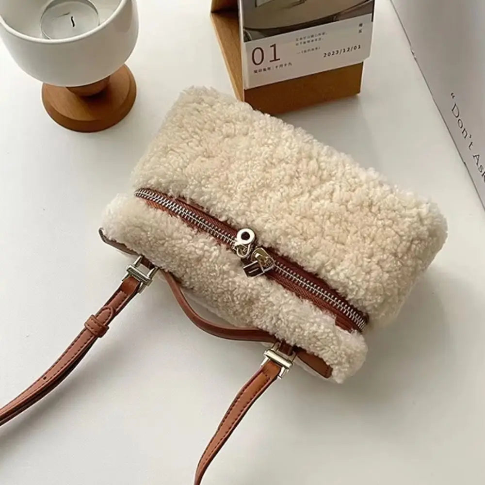 Brown fashion velvet lambskin clutch bag from Corporación Turística, featuring a sleek, elegant design with a soft texture.