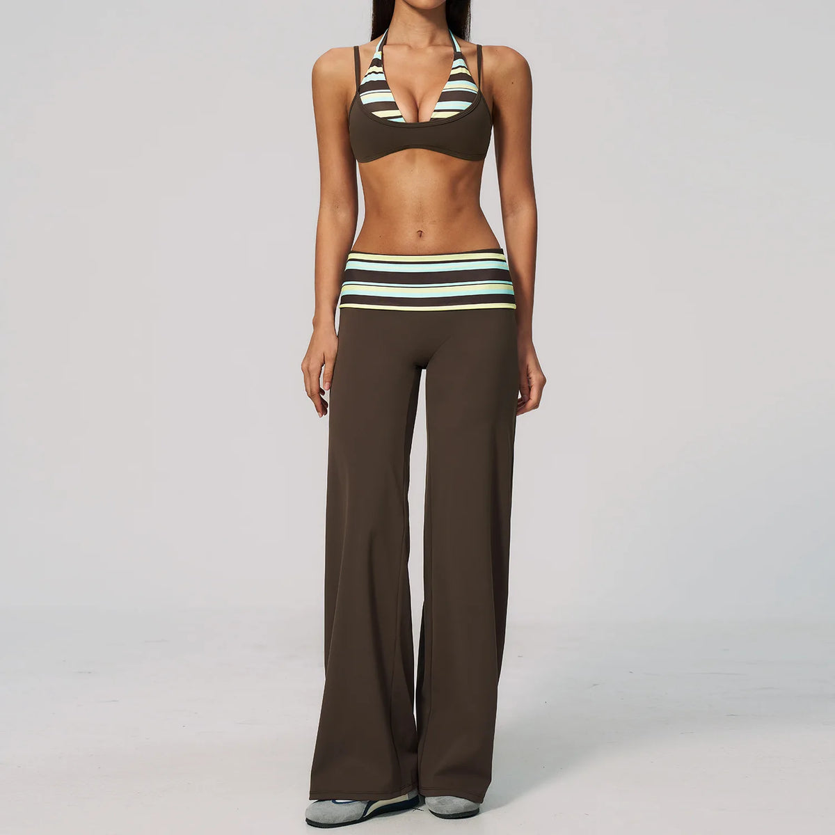 Brown polka dot 2-piece yoga set for women by Corporación Turística, including a fitted top and matching leggings.