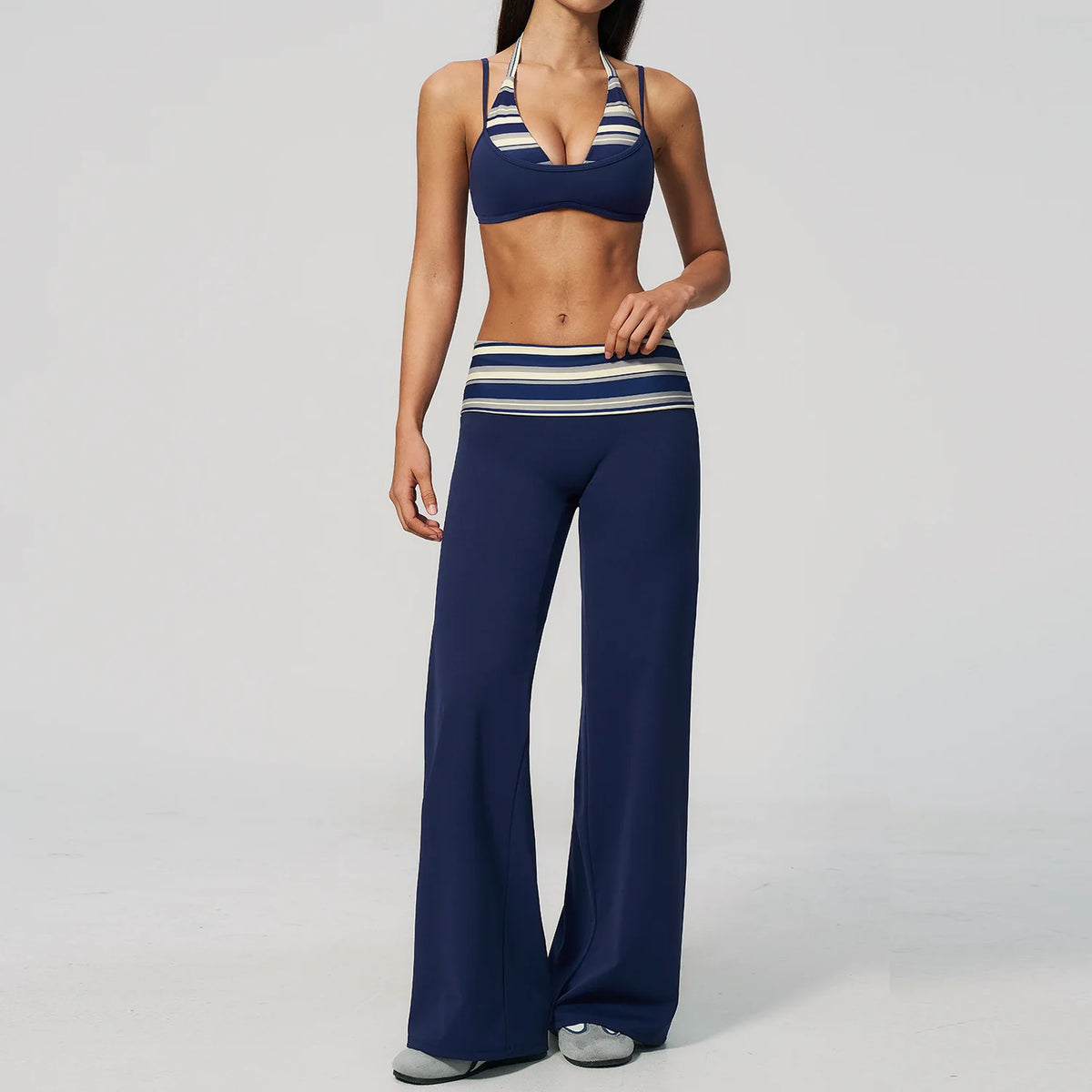 Brown yoga set for women, 2-piece sports outfit by Corporación Turística, including a fitted top and matching leggings.