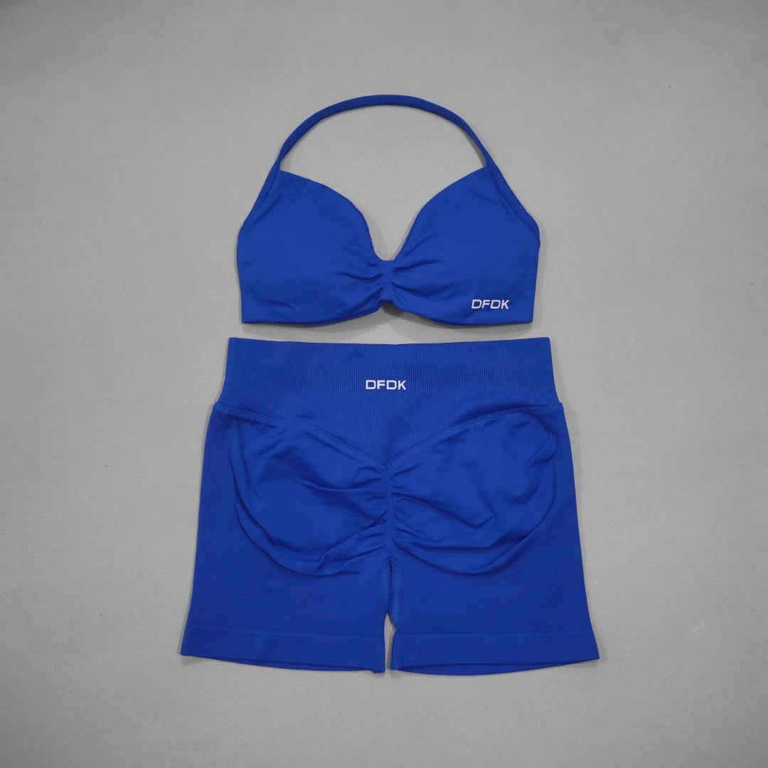 Brown women's 2-piece sports set by Corporación Turística including a sports bra and matching leggings.
