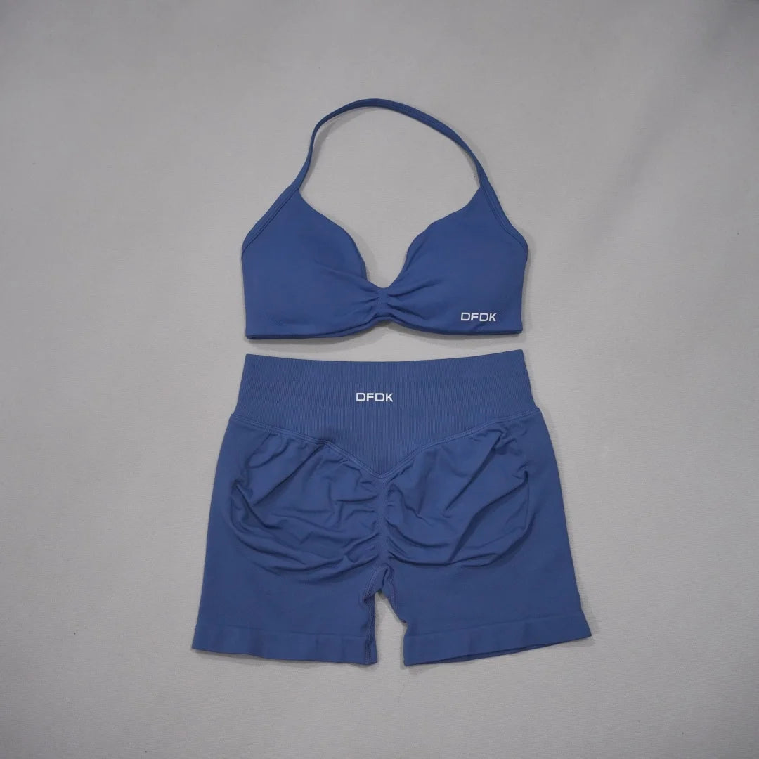 Brown women's 2-piece sports set with DFDK sports bra and matching shorts, designed for active wear by Corporación Turística.