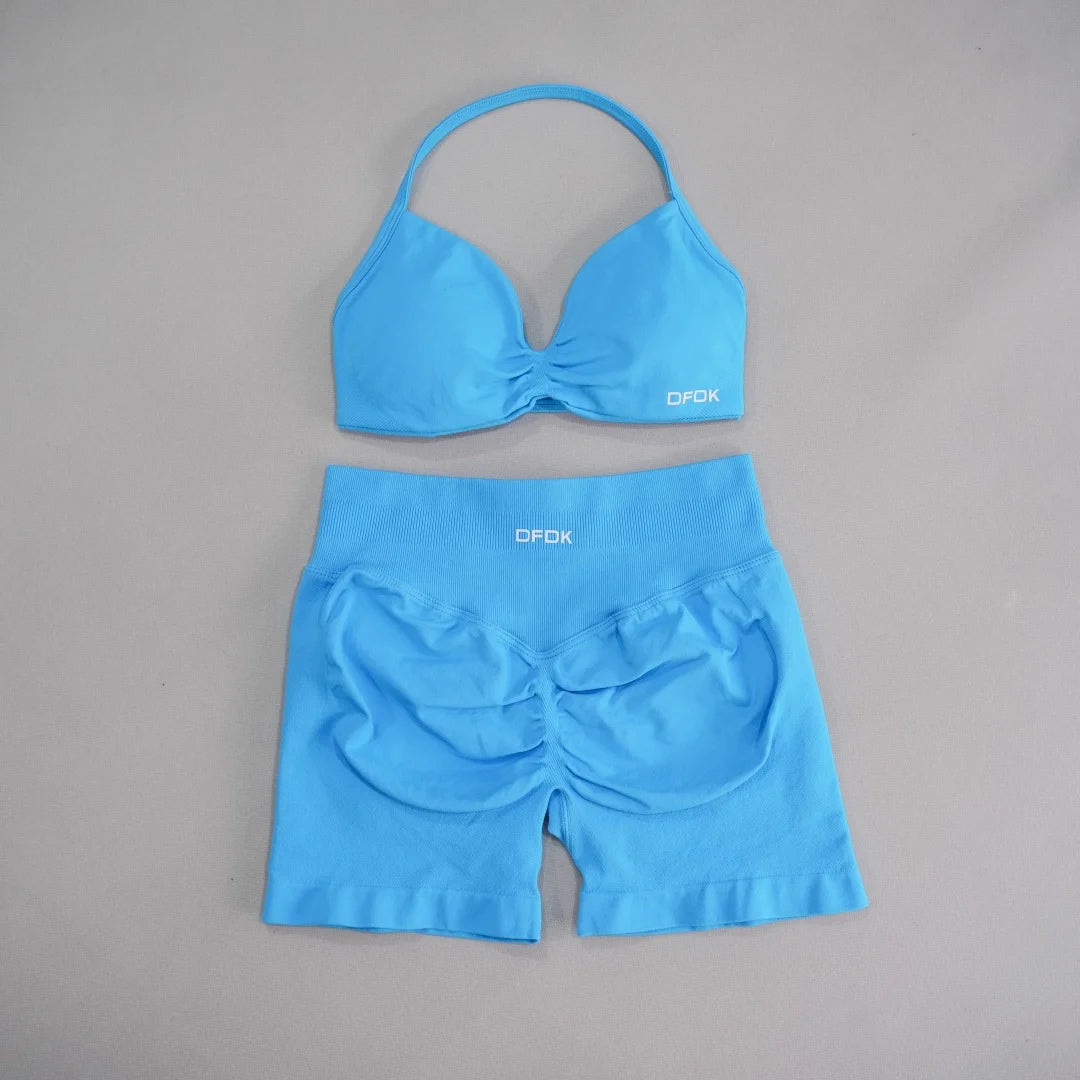 Brown women's 2-piece sports set with DFDK sports bra and matching shorts by Corporación Turística, casual activewear for women.