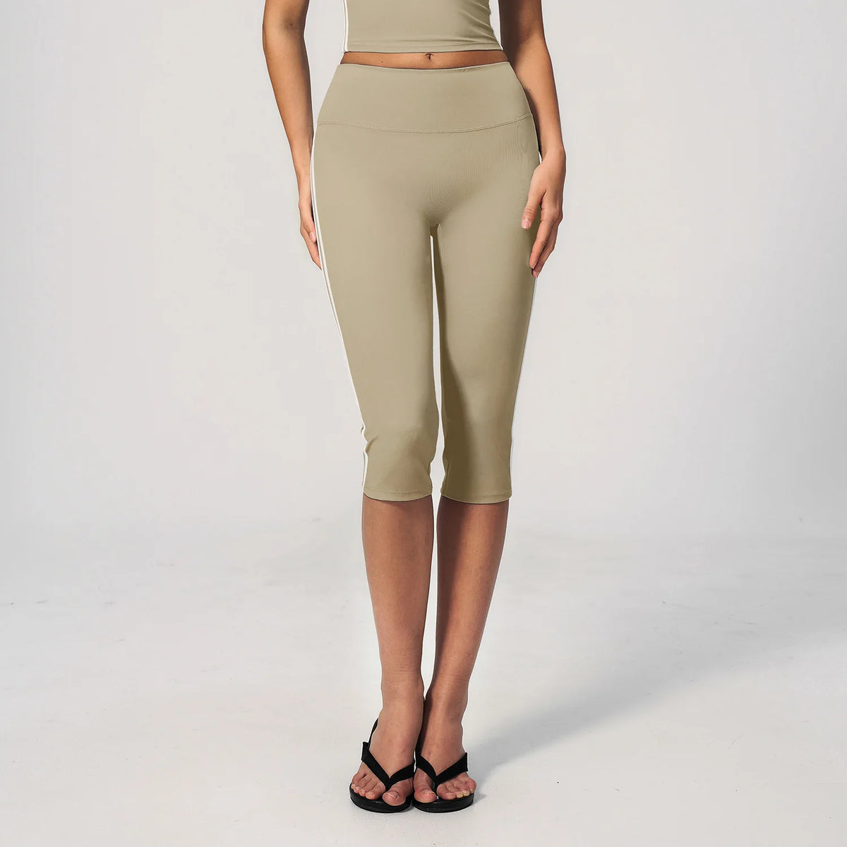 High-waisted women's sports shorts in burnt coffee color, ideal for cycling, from Corporación Turística.