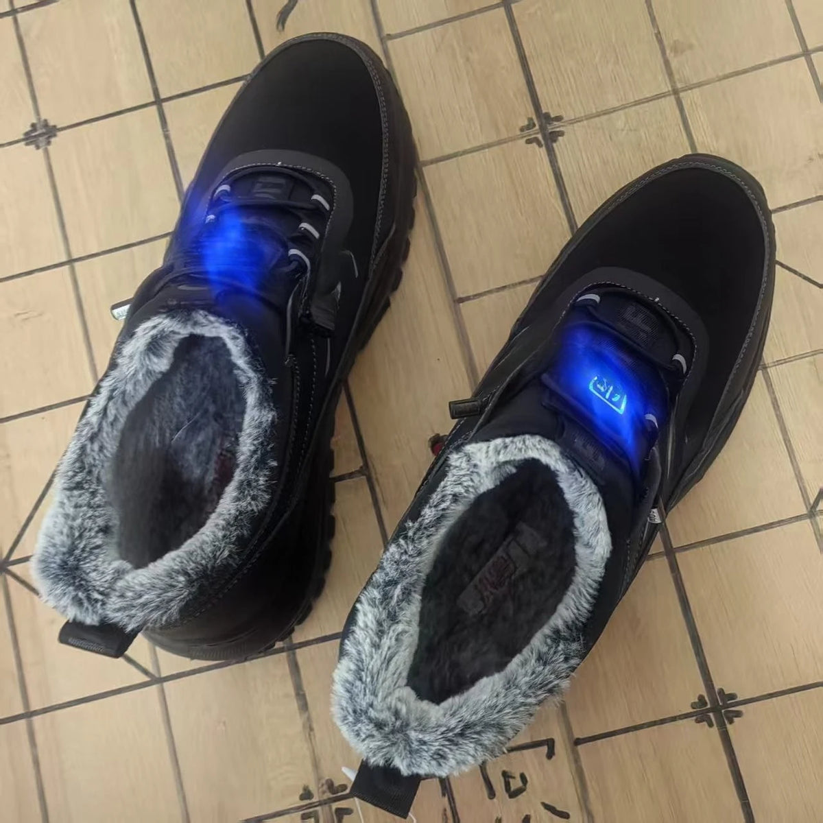 Black electric heated winter shoes for women by Corporación Turística, with smart heating technology and cozy comfort.