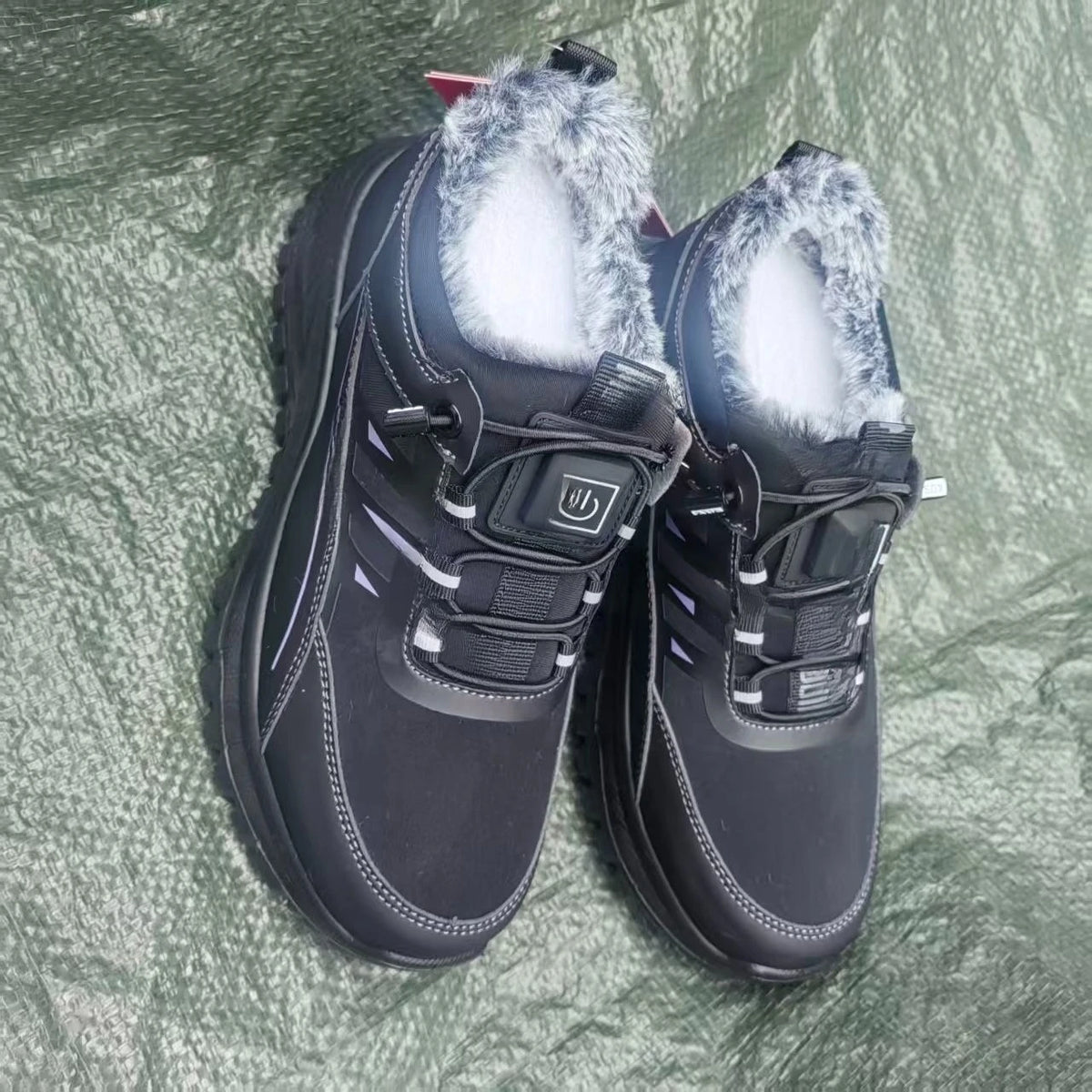 Black electric heated winter shoes for women by Corporación Turística, featuring smart heating technology for superior warmth and comfort.