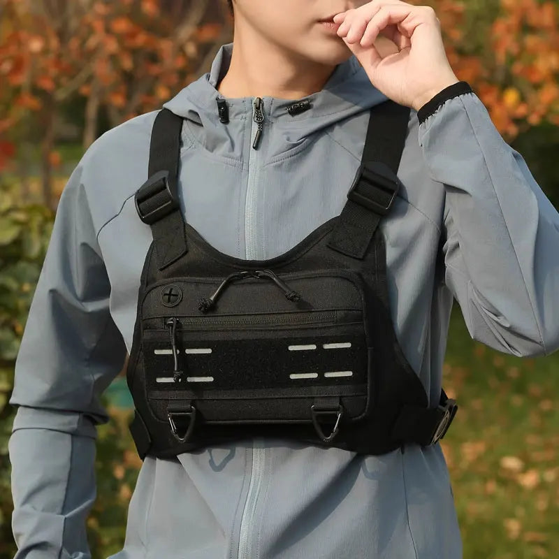 Men's outdoor chest bag by Corporación Turística, lightweight front pouch with adjustable strap in khaki fabric.