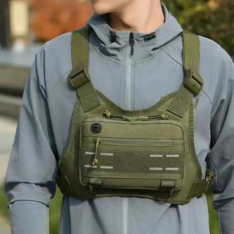 Outdoor men's chest bag by Corporación Turística, caqui color with front pocket and adjustable strap for outdoor activities.