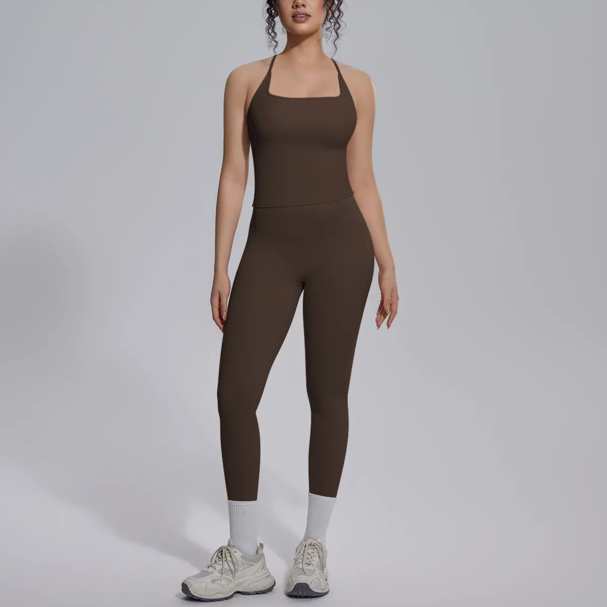 Green two-piece yoga set for women with sports bra and leggings, from Corporación Turística, suitable for gym and activewear.