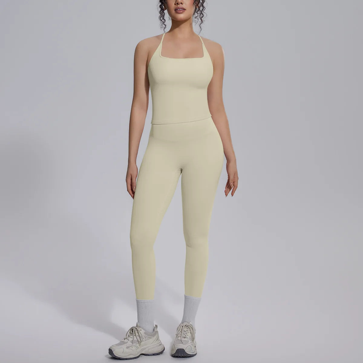 Green two-piece yoga set for women from Corporación Turística, includes fitted top and matching leggings for gym or yoga practice.