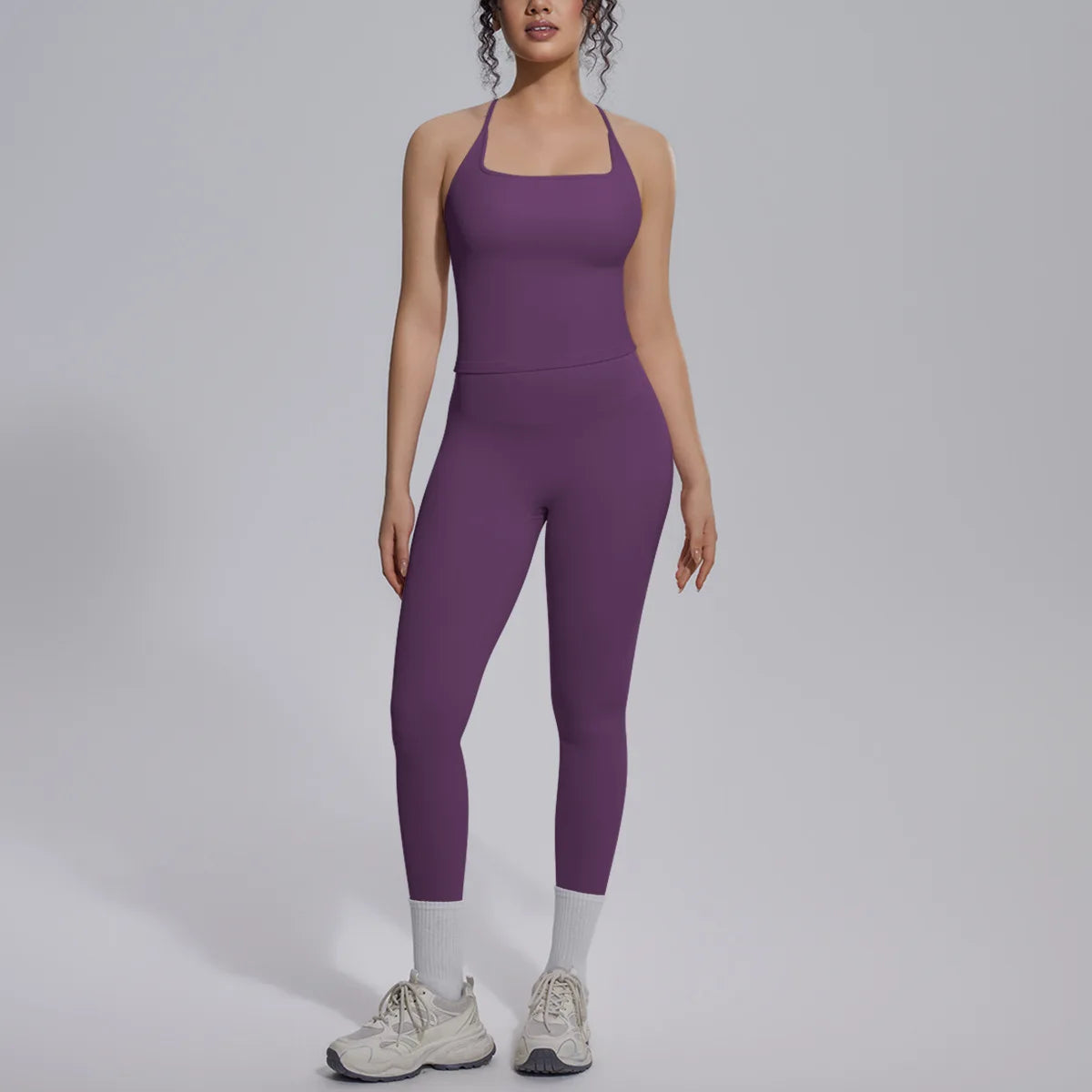 Green two-piece yoga set for women by Corporación Turística, includes a fitted top and matching leggings for gym or yoga practice.