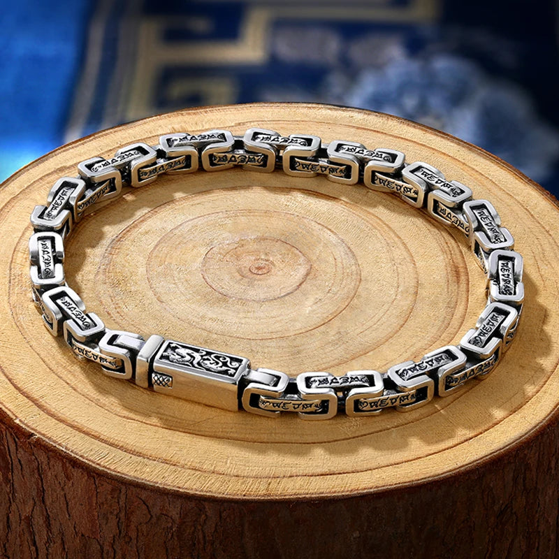 Silver pendant featuring a six-character Dragon Mantra pattern by HX Hanfeng, showcasing intricate design and cultural symbolism.