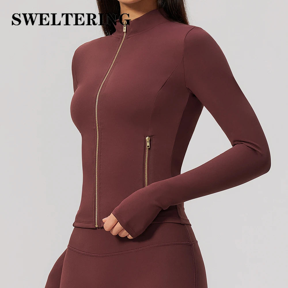 Pink long-sleeve thin sports shirt with front zipper by Corporación Turística, suitable for athletic activities.