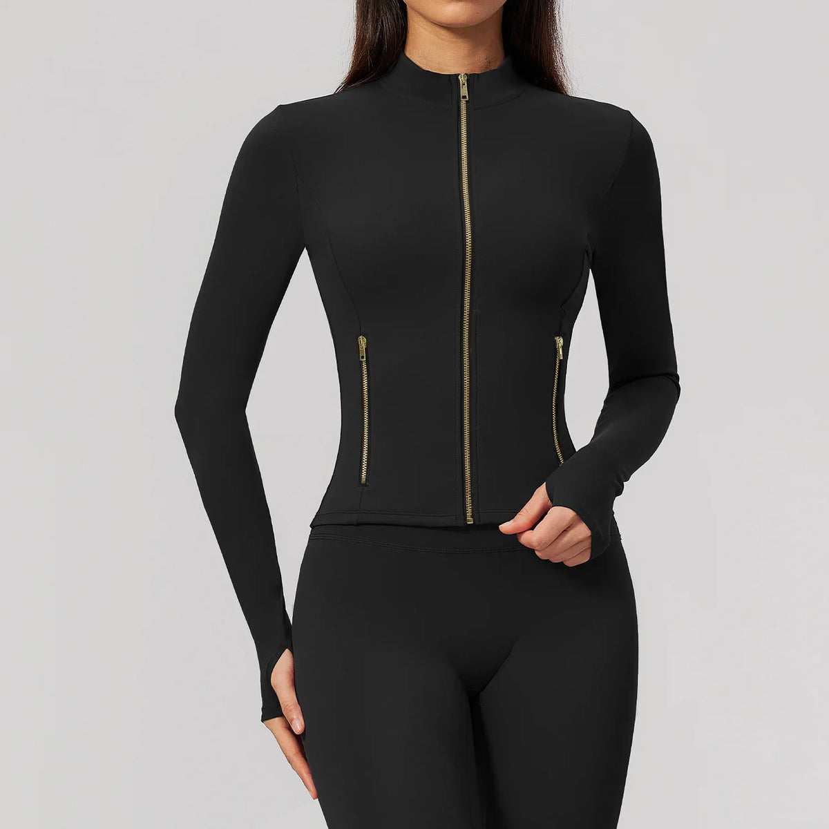 Pink long-sleeve athletic shirt with a front zipper by Corporación Turística, suitable for sports and active wear.