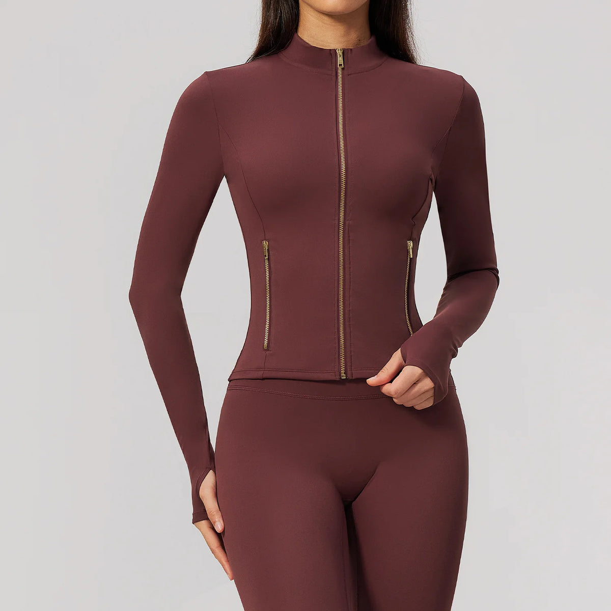 Pink long-sleeve thin sports shirt with front zipper from Corporación Turística, designed for active wear and comfort.