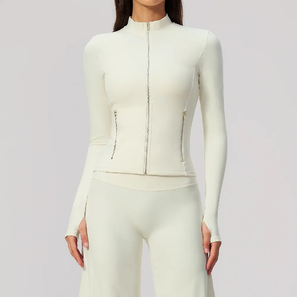 Pink lightweight long-sleeve sports shirt with front zipper by Corporación Turística, suitable for activewear and casual use.