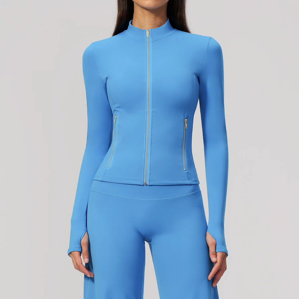 Thin long-sleeve sports t-shirt in cherry blossom pink with front zipper from Corporación Turística, suitable for active wear.