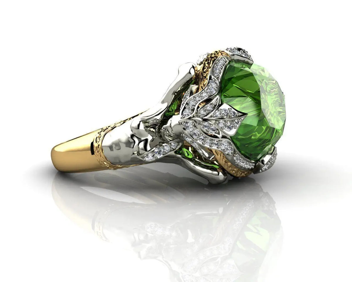 Gold ring featuring natural emerald gemstones, showcasing vibrant green stones set in a polished gold band.
