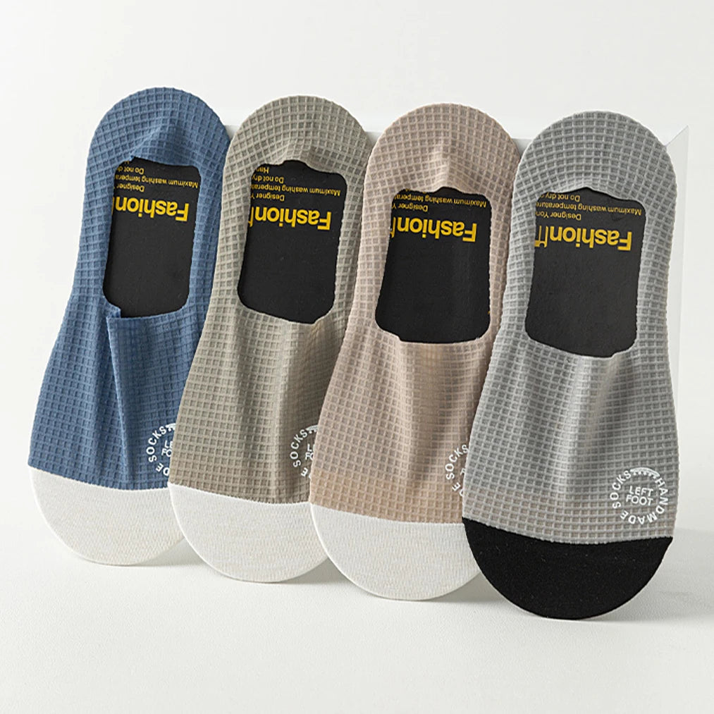 Three pairs of dark grey men's invisible socks from Corporación Turística, suitable for shoe sizes EU 37-44.