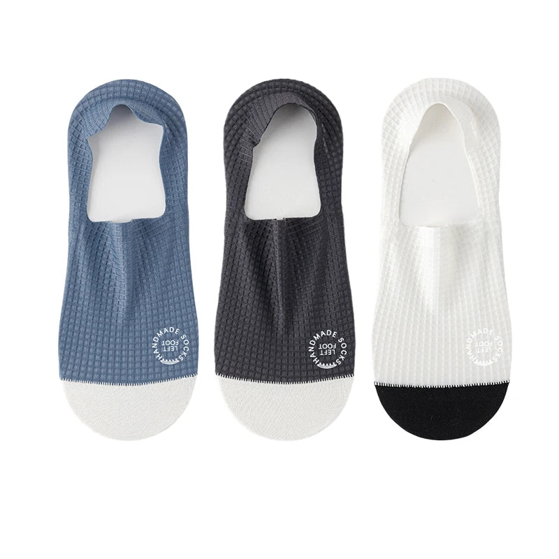 Three pairs of dark grey invisible men's socks from Corporación Turística, size EU 37-44, shown laid flat.