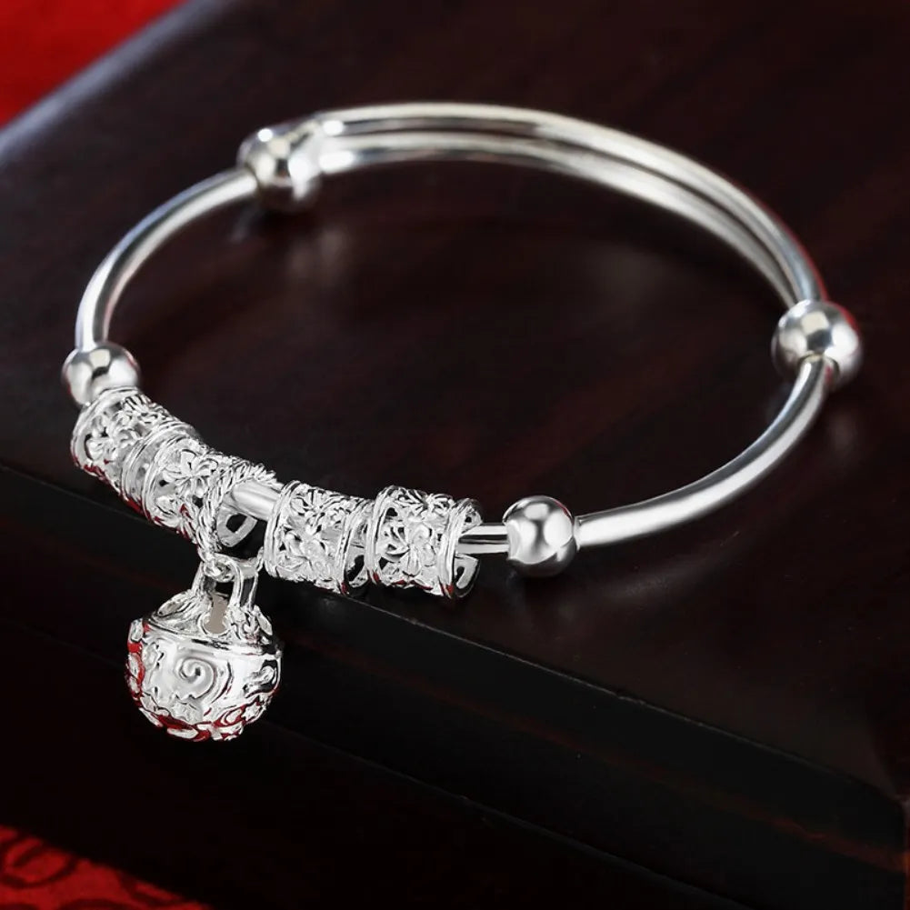 Sterling silver 925 bracelet with hollow bells, featuring intricate design and craftsmanship, ideal for stylish accessorizing.