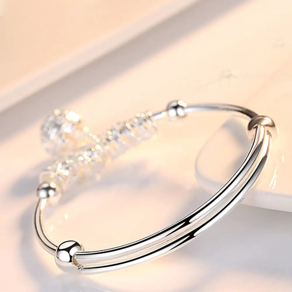 Sterling silver 925 bracelet with hollow bells, featuring intricate design, by Corporación Turística.