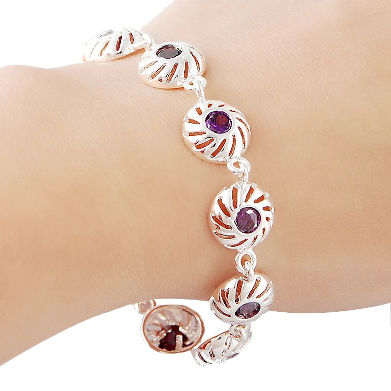 Silver infinity love bracelet for women with elegant design, featuring a polished finish and adjustable chain.