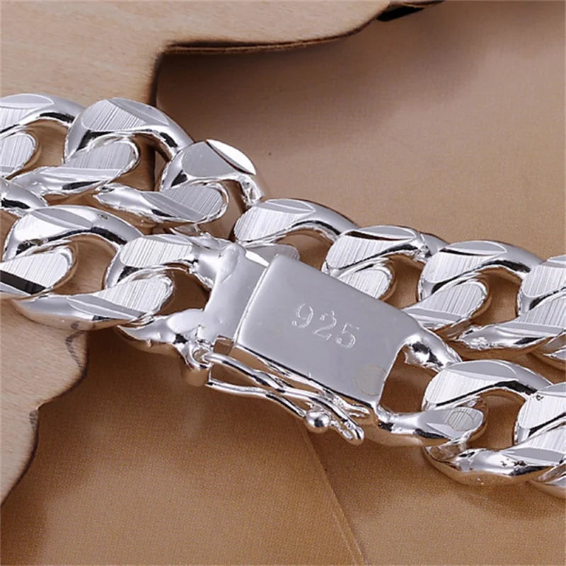Silver 925 fine bracelet for men and women, featuring a sleek, polished design with adjustable chain and clasp closure.