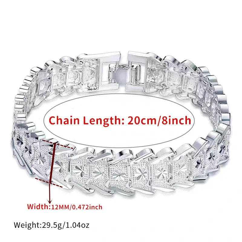 Elegant sterling silver bracelet with coin design, crafted by Corporación Turística, featuring a stylish and sophisticated look.