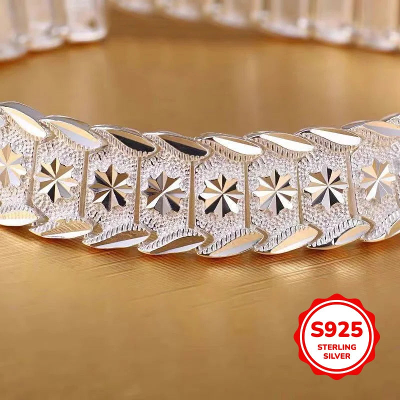 Elegant sterling silver bracelet with coin design, crafted by Corporación Turística, showcasing a stylish and sophisticated jewelry piece.