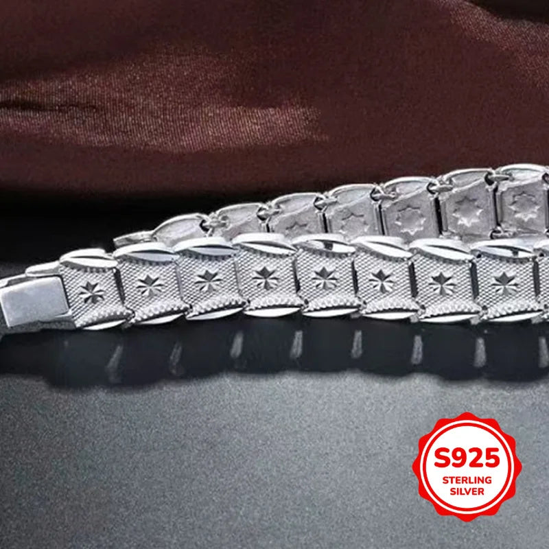 Elegant sterling silver bracelet with coin design, crafted by Corporación Turística, showcasing intricate detailing and stylish appeal.