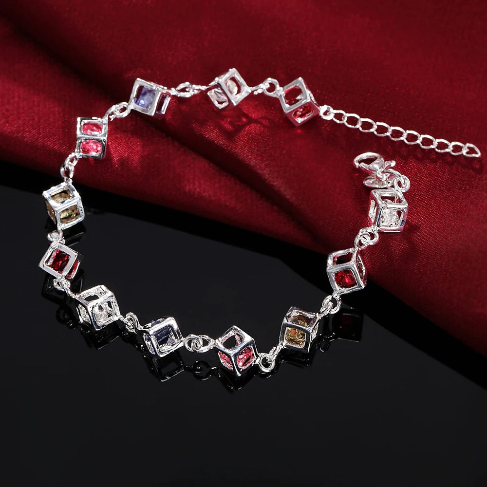 Fine sterling silver bracelet with intricate lattice design and cubic zirconia accents, showcasing elegant craftsmanship.