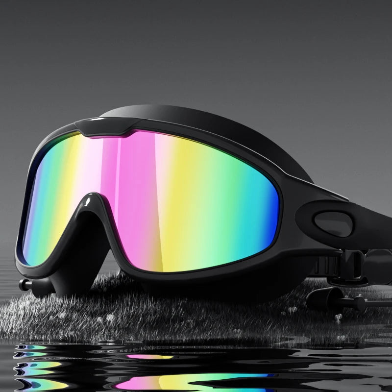 Unisex adult swimming goggles with wide view, anti-fog, UV protection, black transparent lenses, designed for swimming sports.