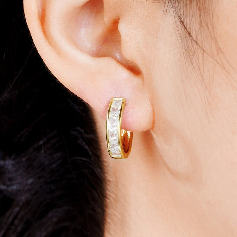 Classic hoop earrings for women by Corporación Turística, featuring a simple round design and polished finish.