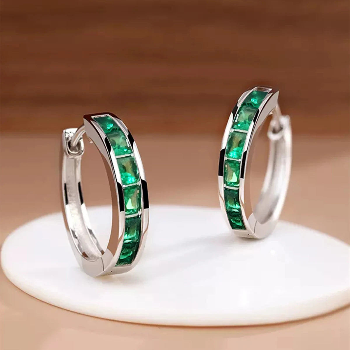 Classic gold hoop earrings for women, stylish circular design, by Corporación Turística, shown on a white background.