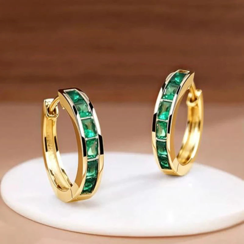 Classic hoop earrings for women by Corporación Turística, featuring a simple and elegant circular design.