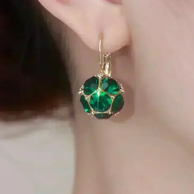 Exquisitos pendientes colgantes de cristal en forma de gota, con diseño elegante, de la marca Corporación Turística.