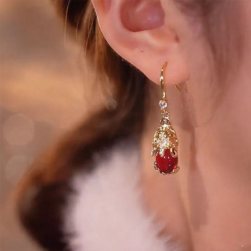 Red Retro Pixiu earrings for women, stylish fashion jewelry by Corporación Turística featuring intricate design and vibrant color.
